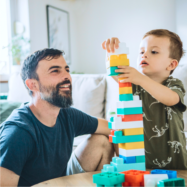 Father and child building lego structure